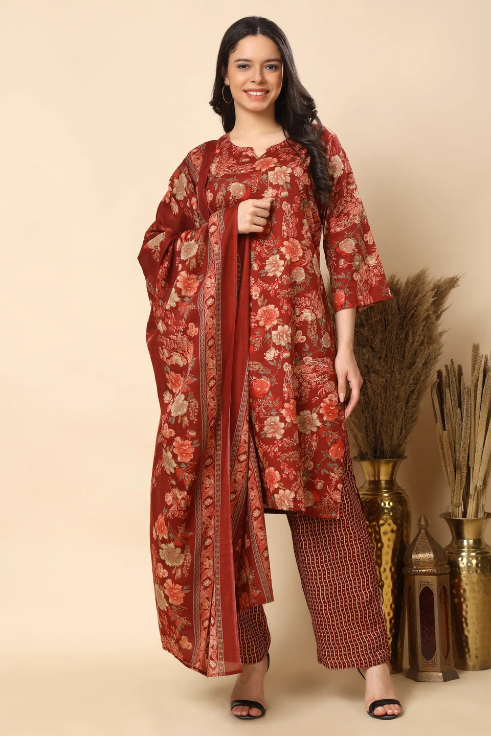 Stylish women wearing red floral kurta set festive look