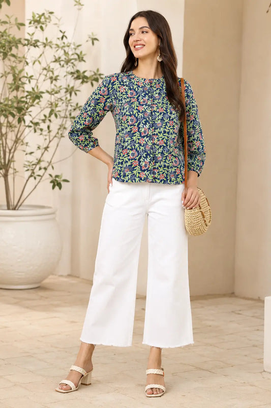Woman wearing Rabric blue floral cotton short top styled with white wide leg pants for casual chic fashion