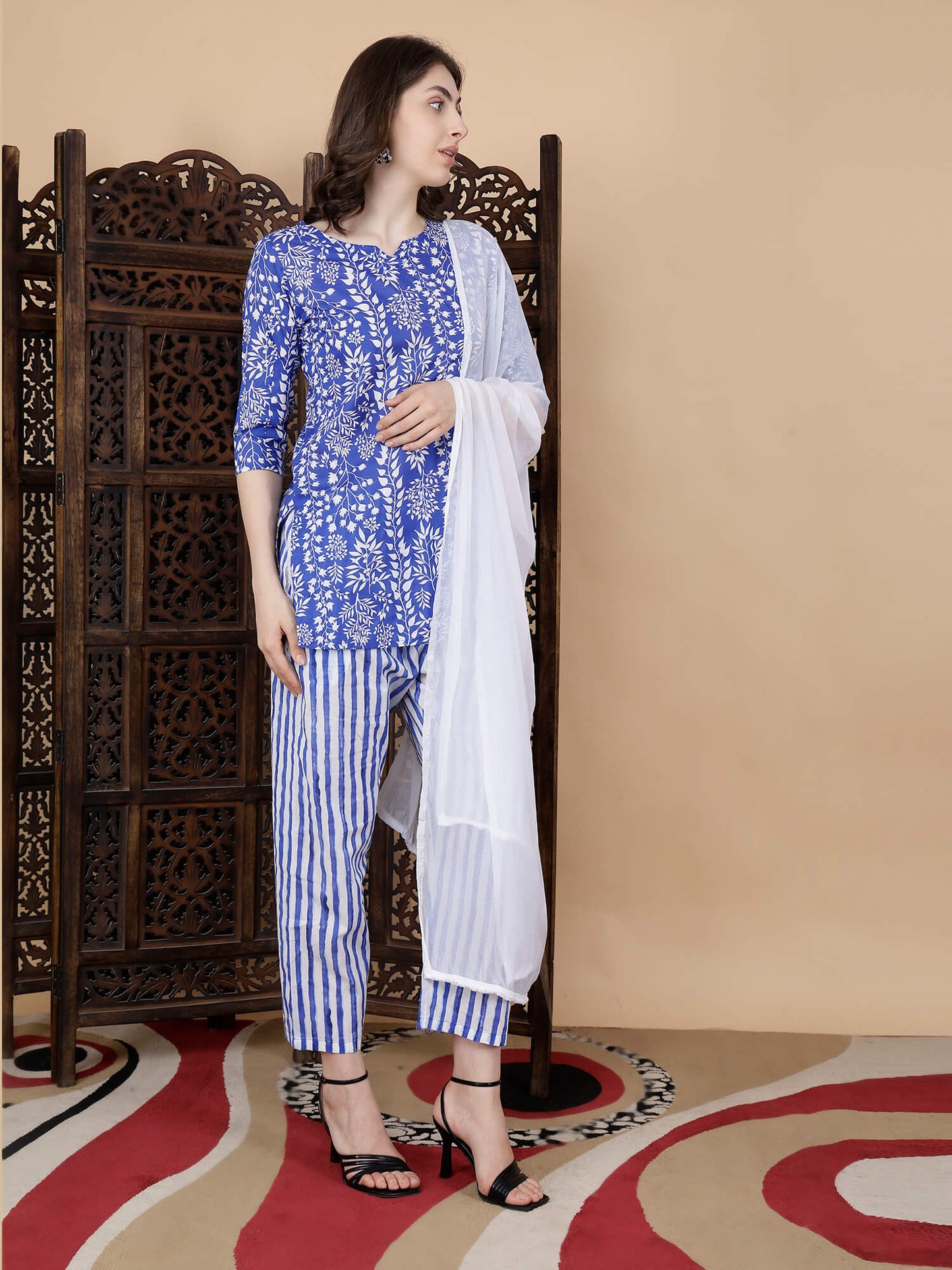 Round neckline with brass button detailing on Rabric kurti