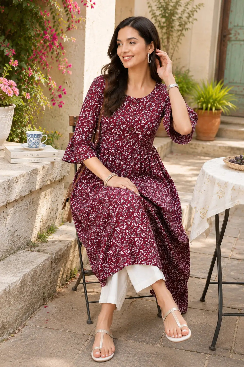 Rabric maroon floral crepe kurti lifestyle sitting pose with casual accessories and modern ethnic styling