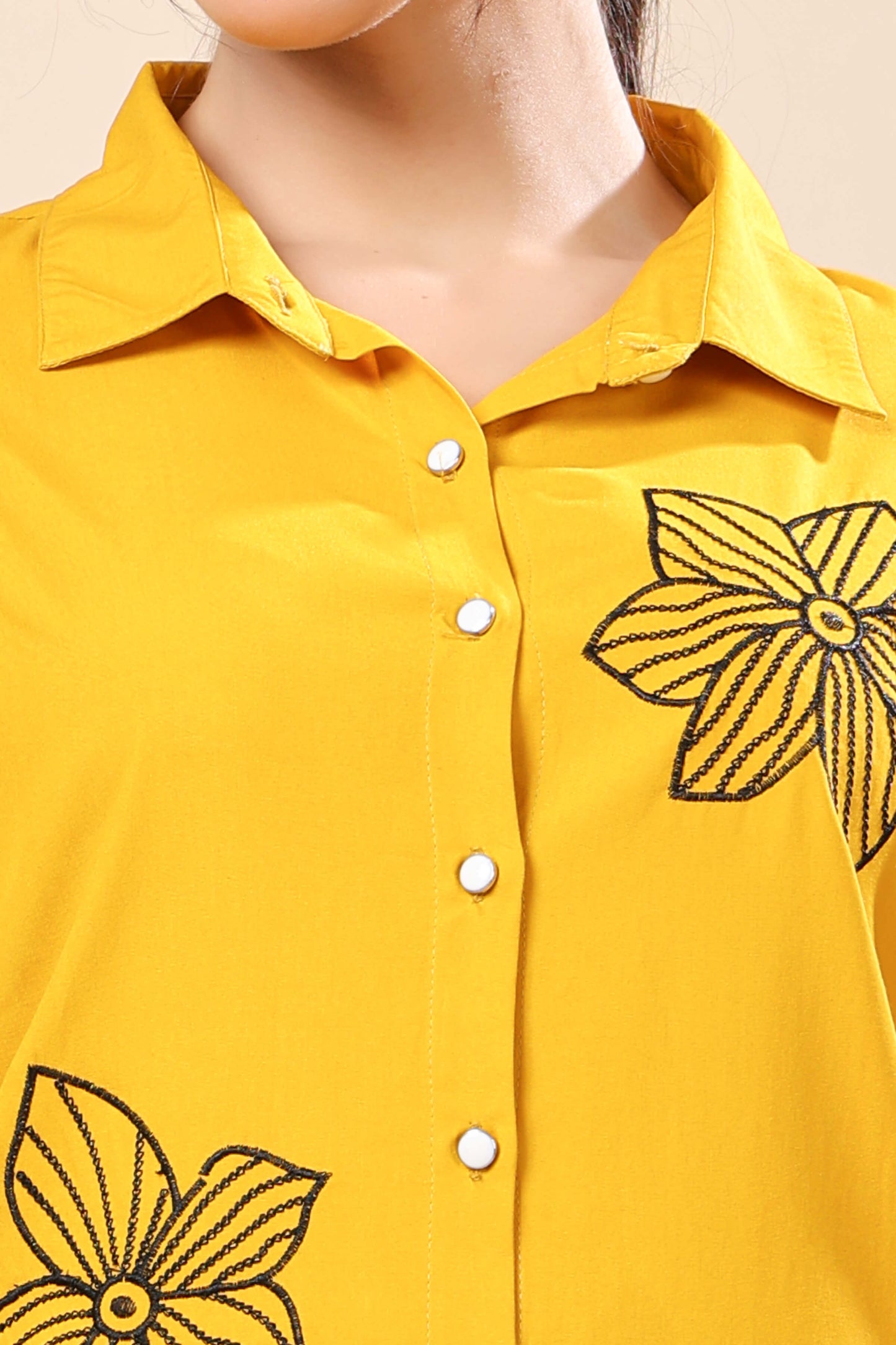 Close-up of floral embroidery design on Rabric co-ord set