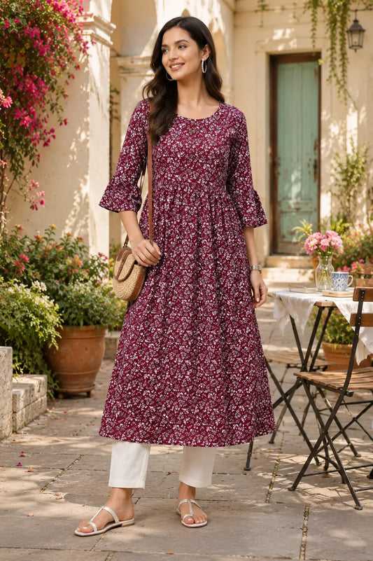 Woman wearing Rabric maroon floral crepe kurti styled with casual accessories for trendy ethnic lifestyle fashion