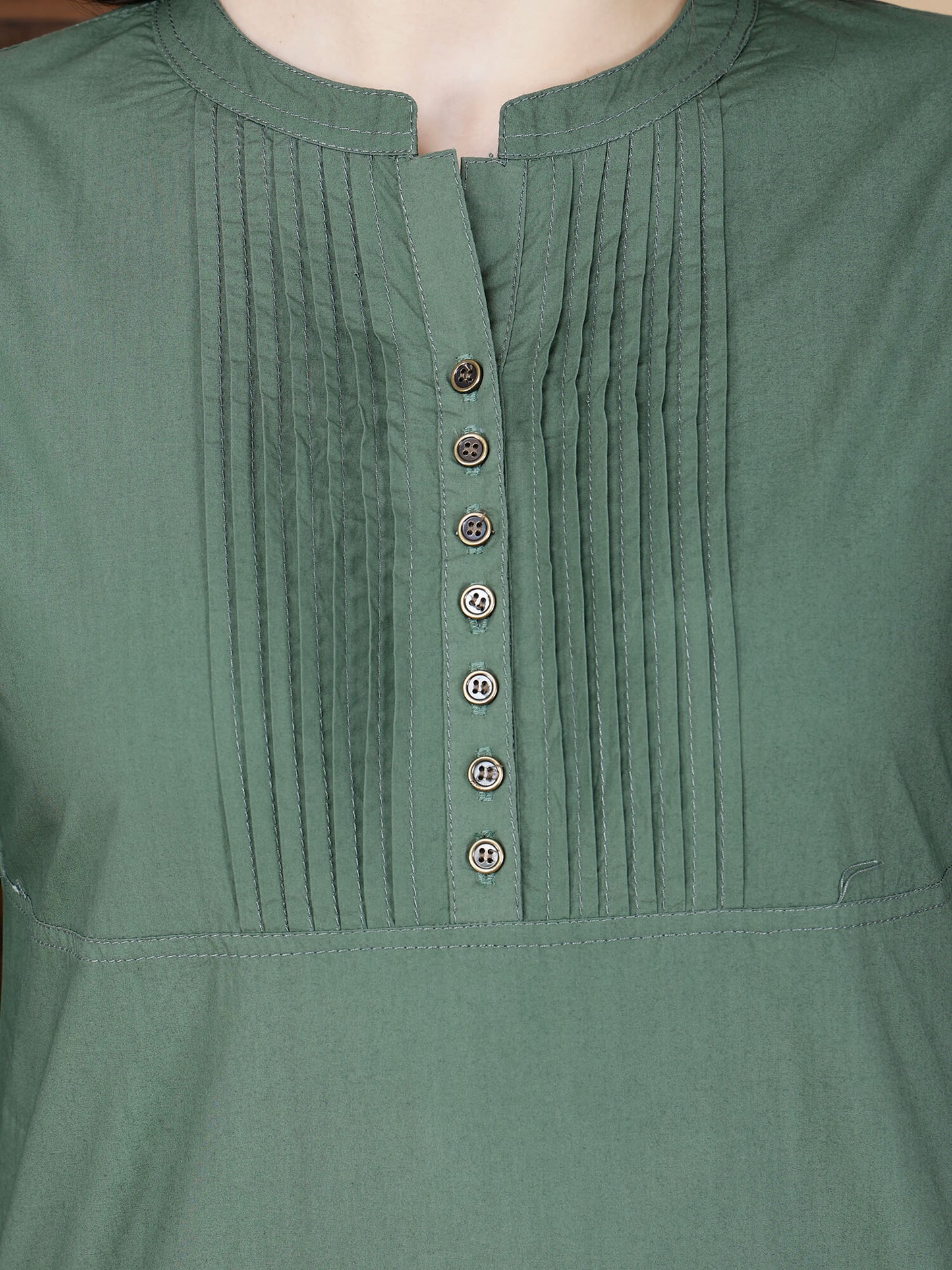 Close-up of pintuck design and brass button details on Rabric Poplin Cotton Kurti