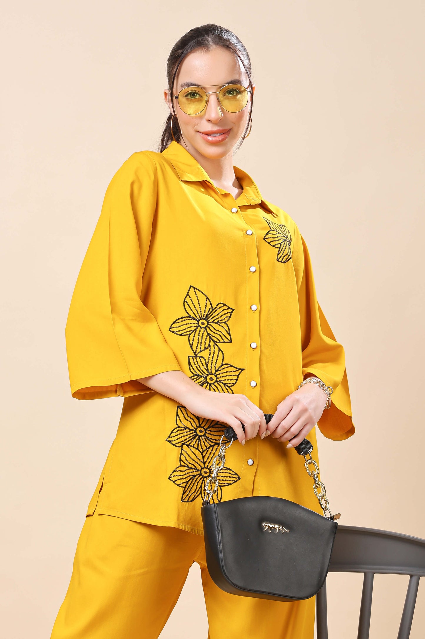 Model wearing Rabric mustard yellow floral co-ord set