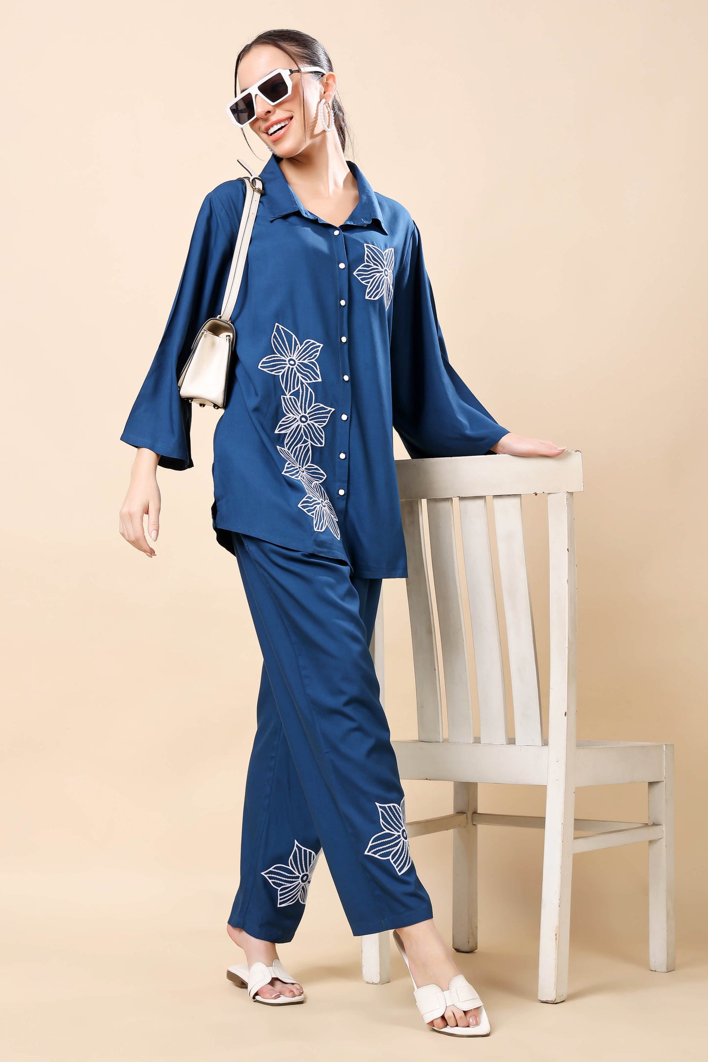 Model wearing Rabric navy blue floral embroidered co-ord set