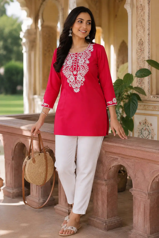 Lifestyle fashion image of women wearing Rabric embroidered cotton kurti with casual accessories