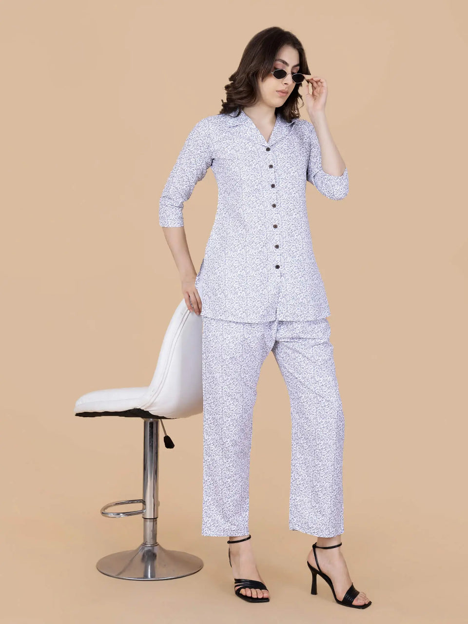 Detailed view of white floral print on glace cotton fabric