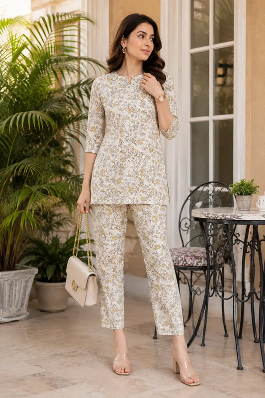 Rabric women off white and yellow floral rayon co-ord set front view with short kurti and straight pant, stylish 3/4 sleeve printed lounge wear set for women