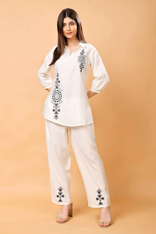 Model wearing Rabric white embroidered co-ord set in premium Vertican fabric