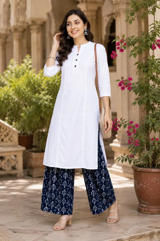 Women wearing white popline cotton kurti in casual lifestyle look with stylish palazzo pants and ethnic accessories by Rabric