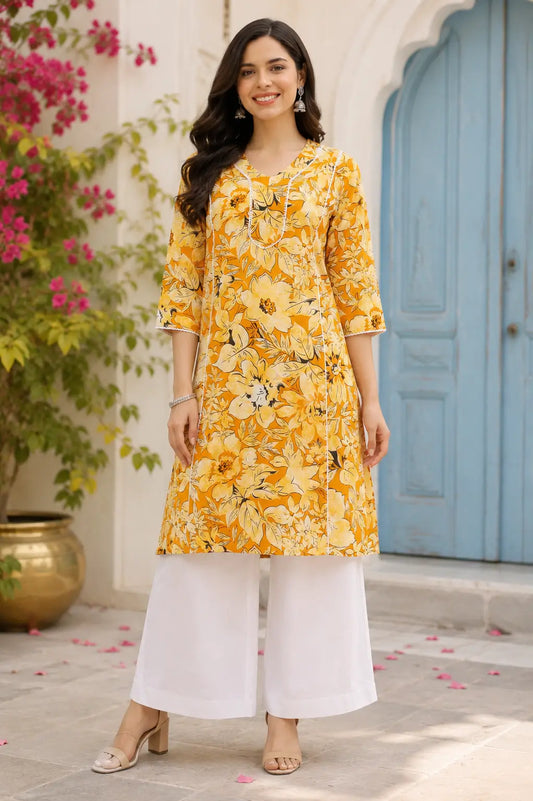 Rabric yellow floral cotton kurti for women front view with stylish neck design, mid length kurta, 3/4 sleeves and white palazzo pants