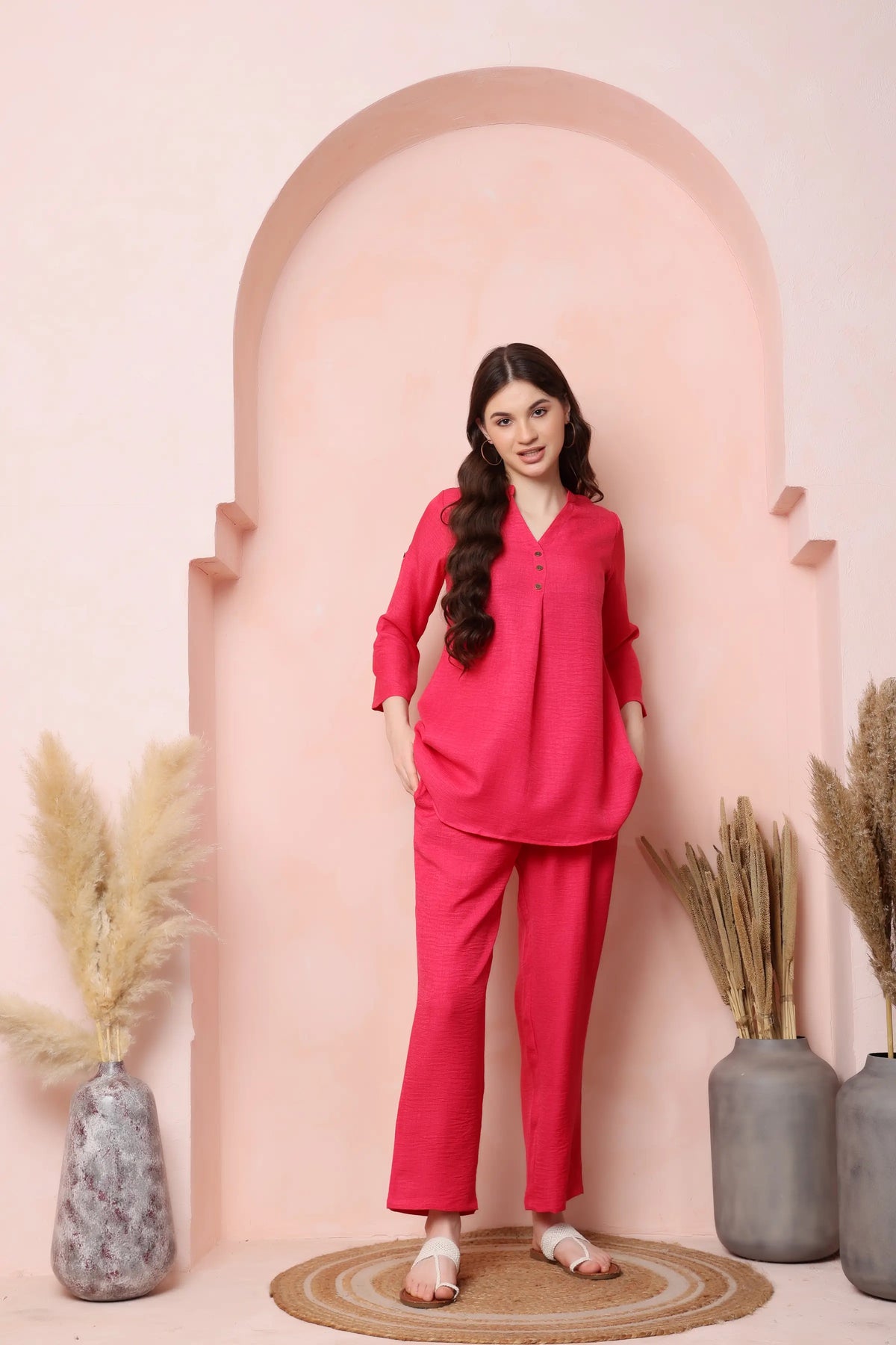 Front view of RABRIC coral pink twill co-ord set with a lightly flared top and relaxed trousers