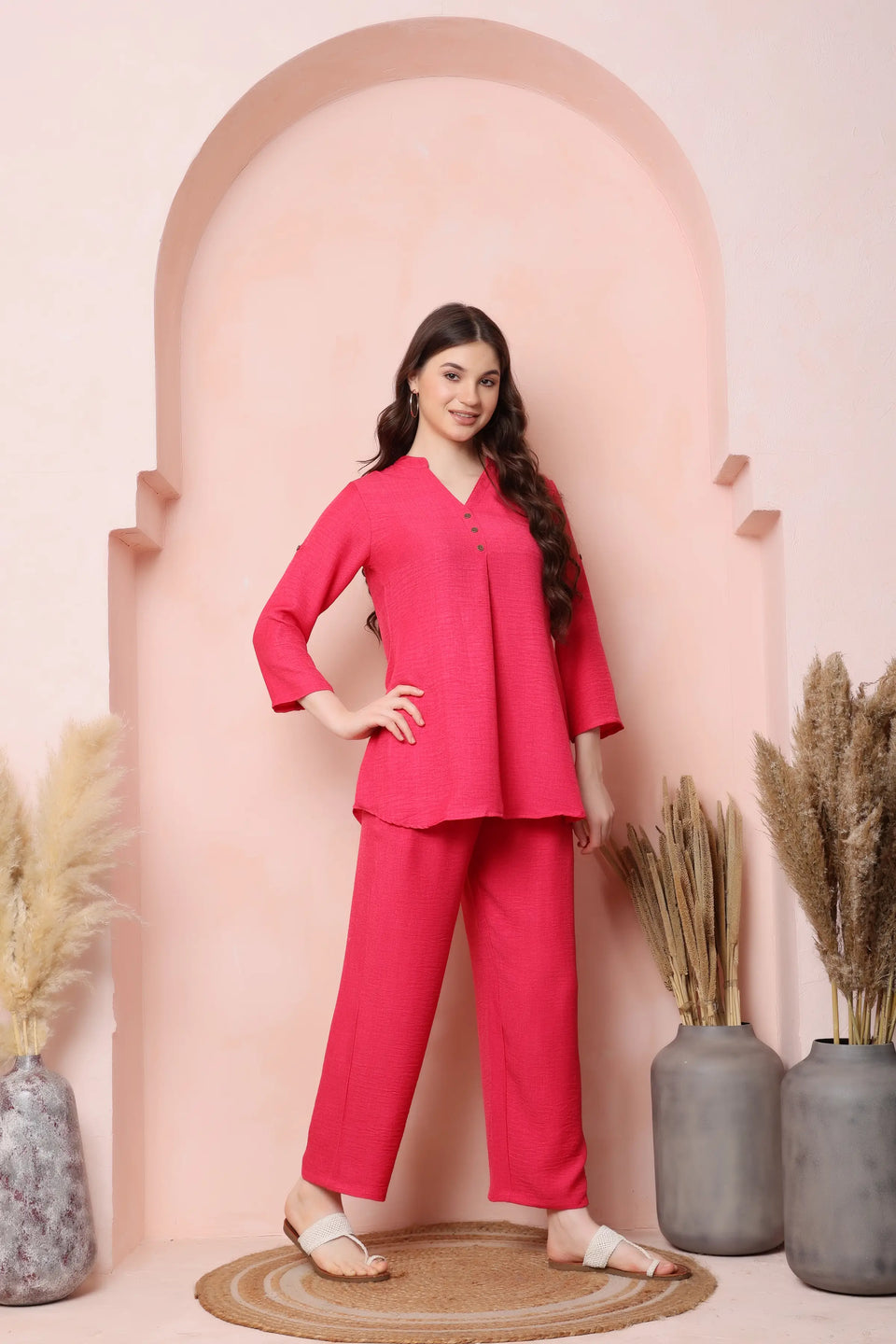 Left-side view of RABRIC coral pink twill co-ord set showing the lightly flared top