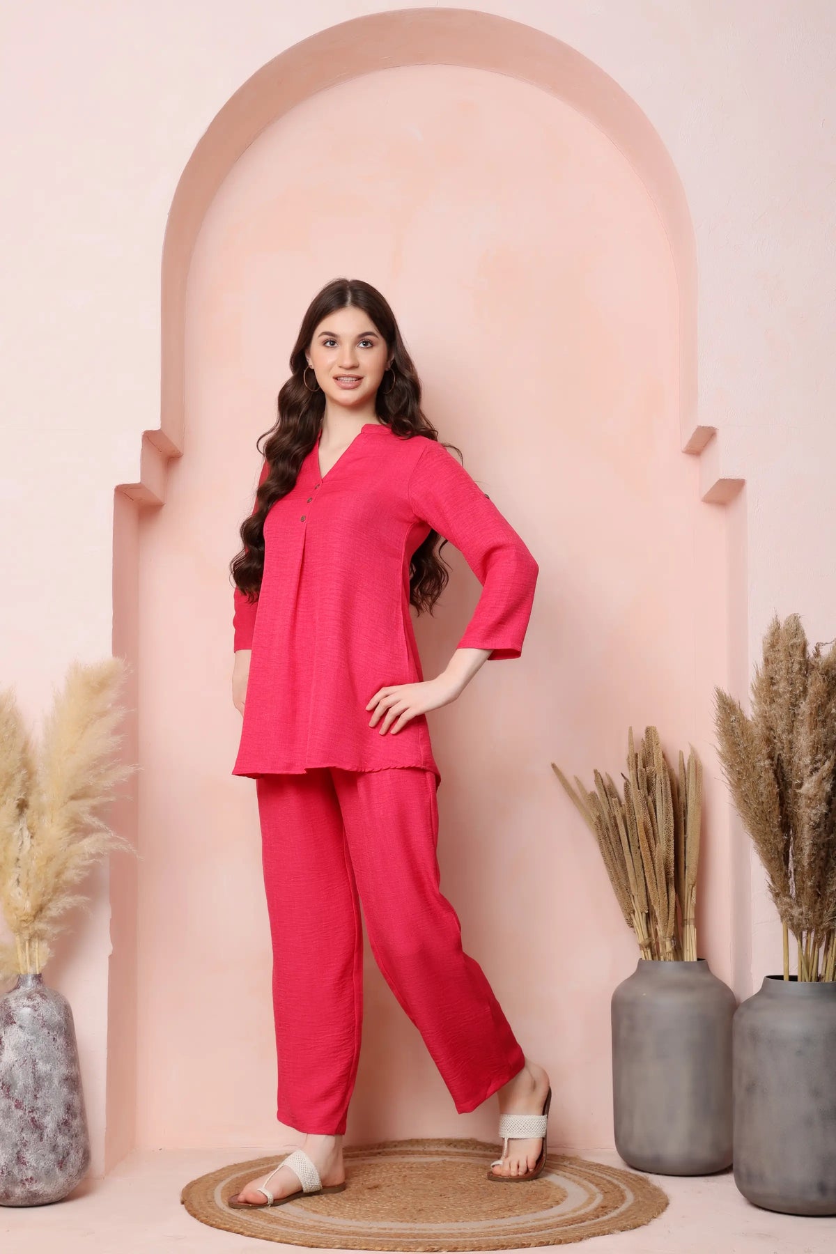 Right-side view of RABRIC coral pink twill co-ord set showing the top and relaxed trousers