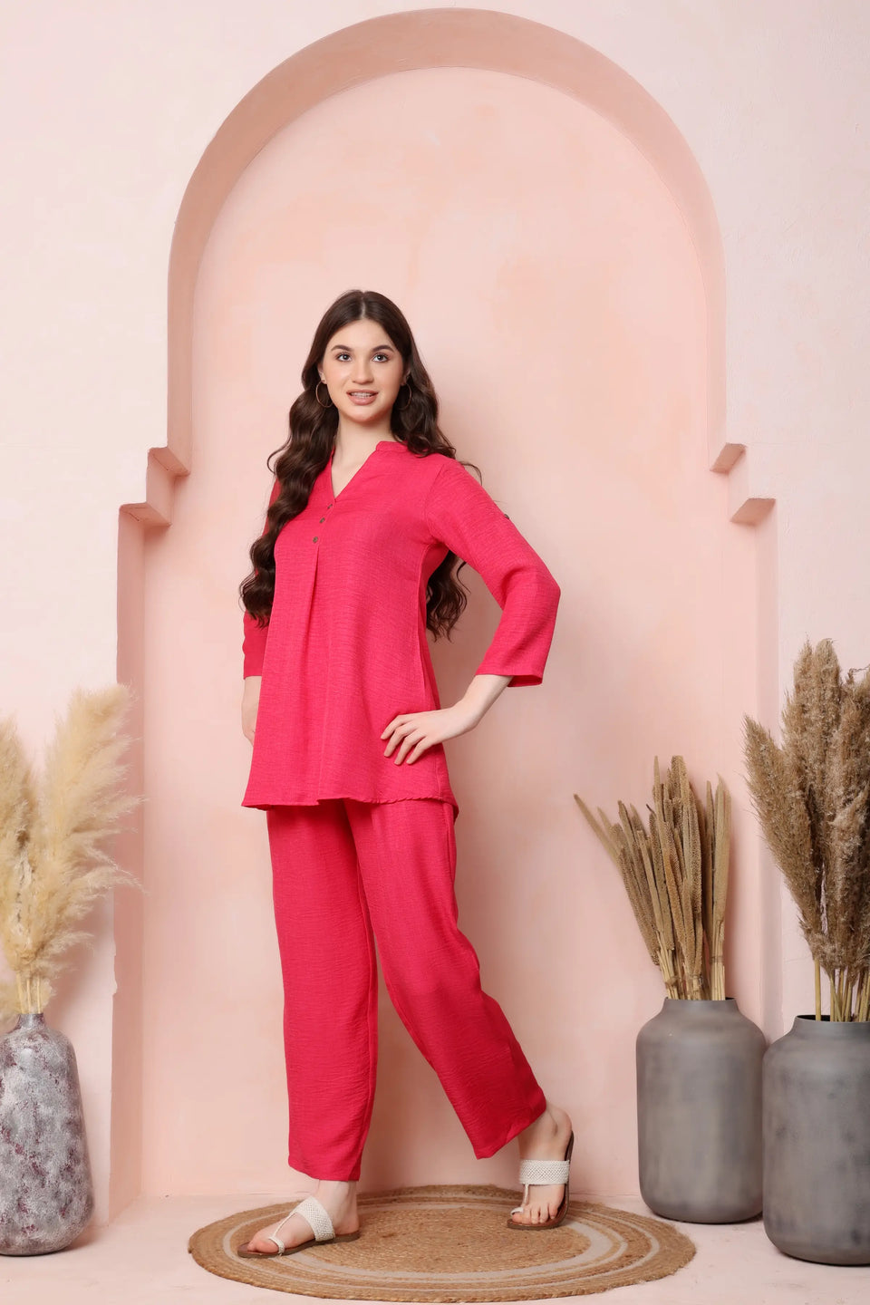 Right-side view of RABRIC coral pink twill co-ord set showing the top and relaxed trousers