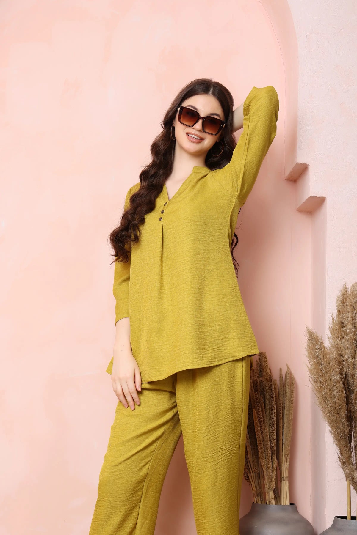Model standing in RABRIC mustard yellow twill co-ord set, showing the relaxed top and trouser fit.