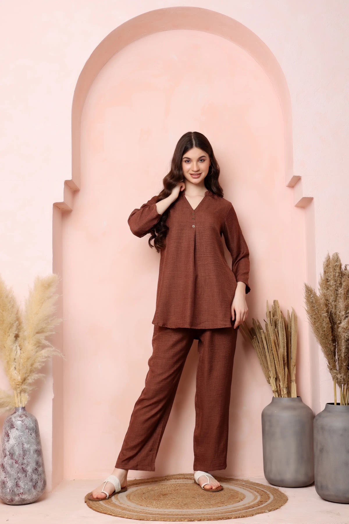 Front view of RABRIC rust brown twill co-ord set with a gently flared top and relaxed trousers.