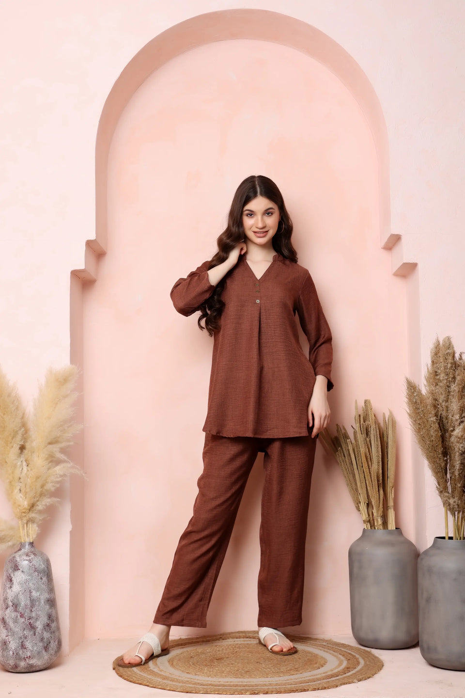 Front view of RABRIC rust brown twill co-ord set with a gently flared top and relaxed trousers.