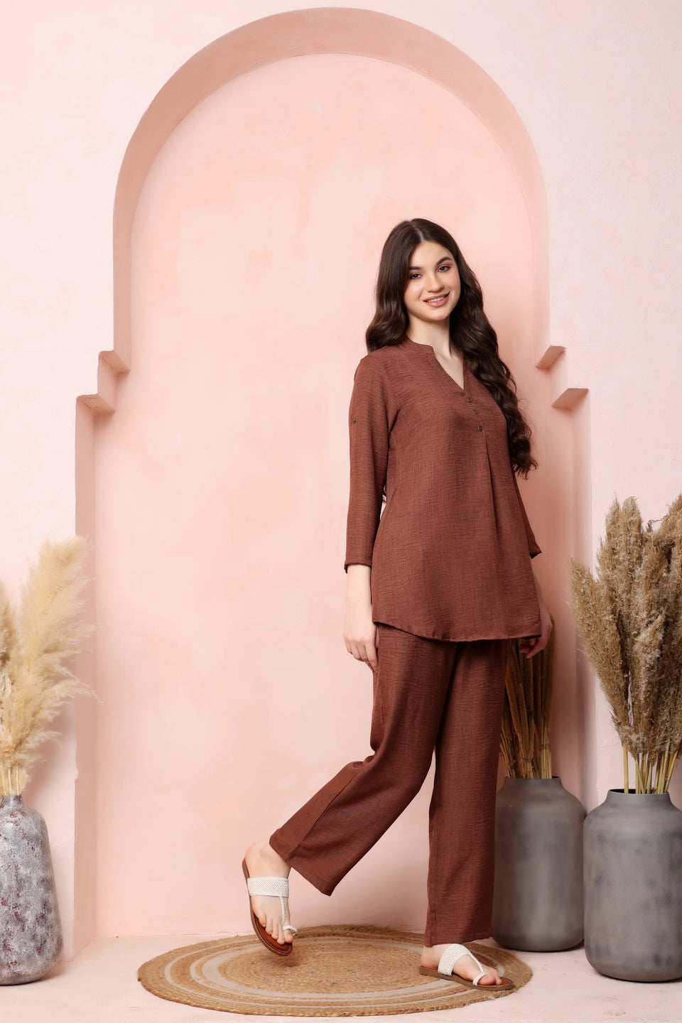 Left-side view of RABRIC rust brown twill co-ord set showing the flared top and relaxed trouser fit.
