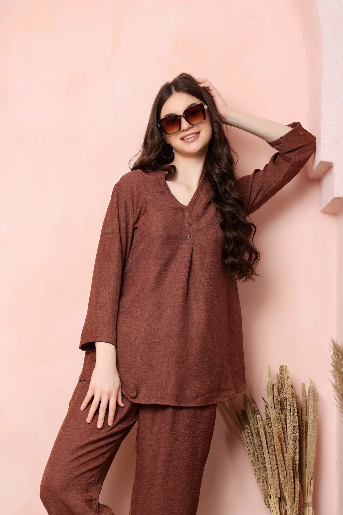 Model wearing RABRIC rust brown twill co-ord set with neutral flats for a casual daytime look.
