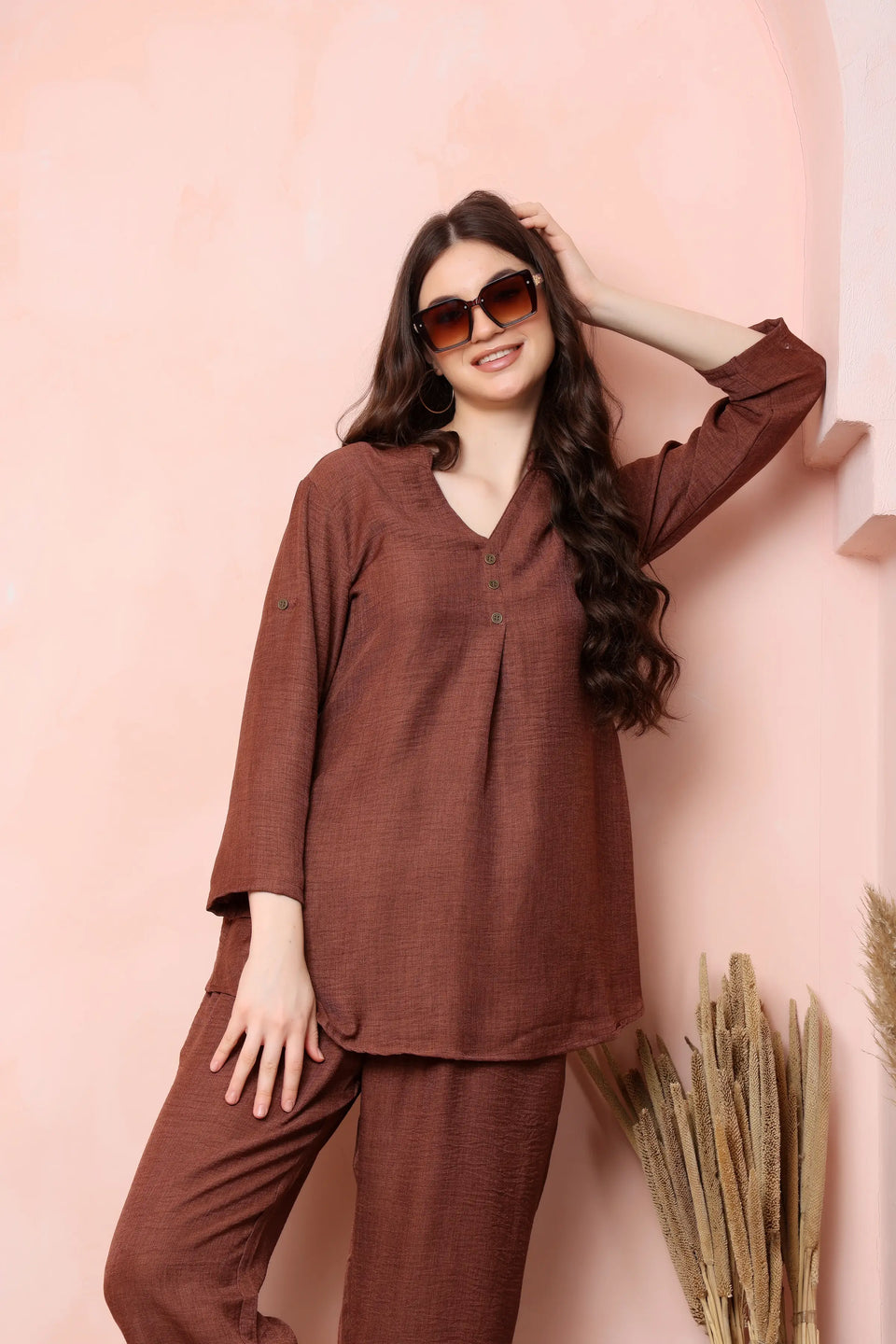 Model wearing RABRIC rust brown twill co-ord set with neutral flats for a casual daytime look.