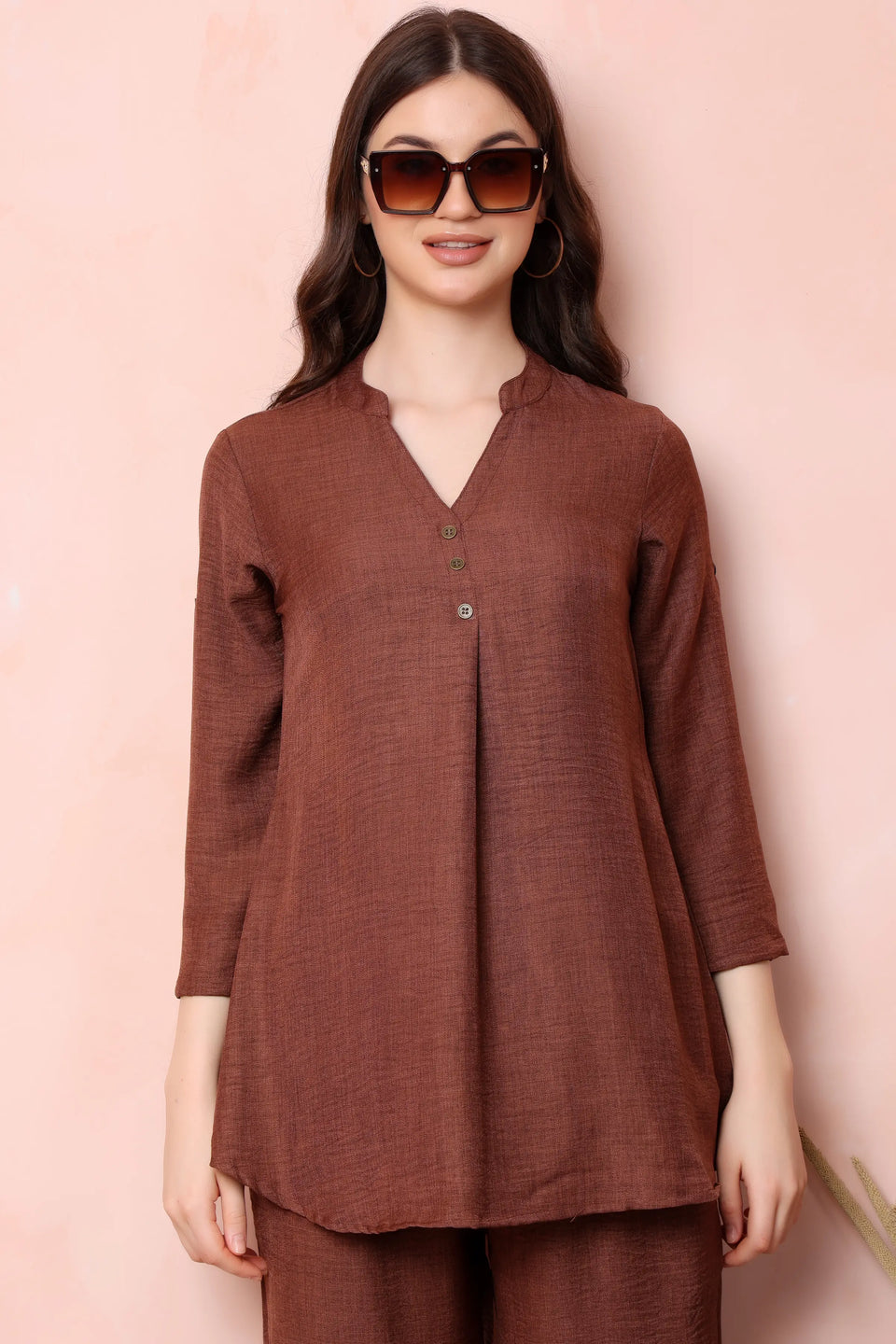Close-up of RABRIC rust brown twill co-ord top showing the band collar, V-opening and front buttons.