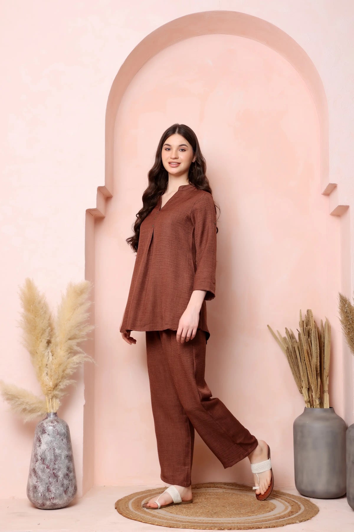 Right-side view of RABRIC rust brown twill co-ord set showing the three-quarter sleeves and curved hem.