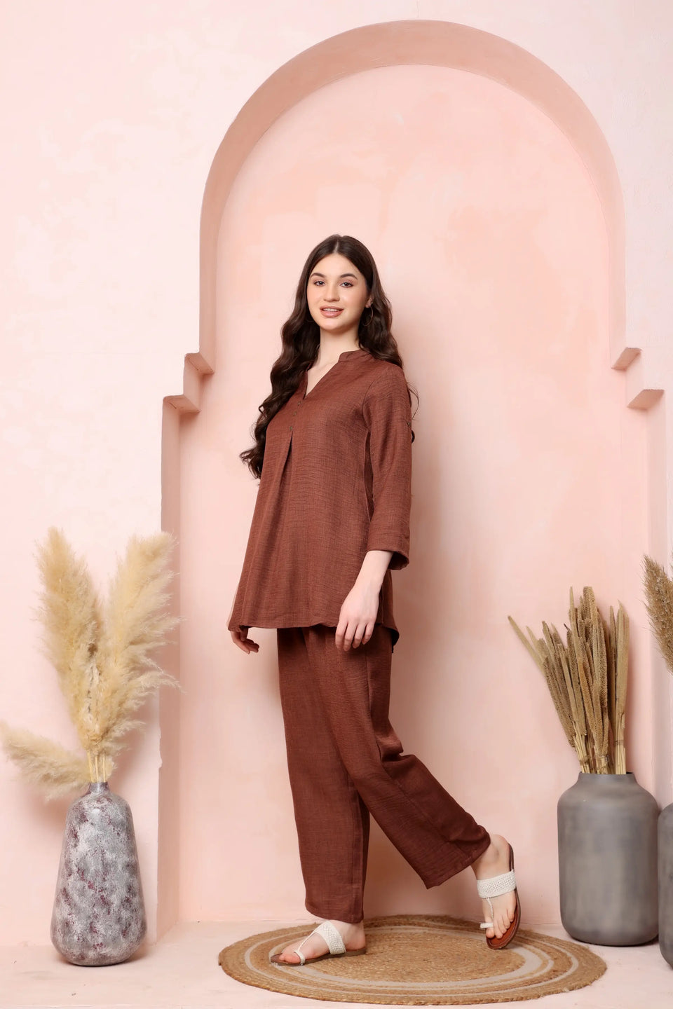 Right-side view of RABRIC rust brown twill co-ord set showing the three-quarter sleeves and curved hem.