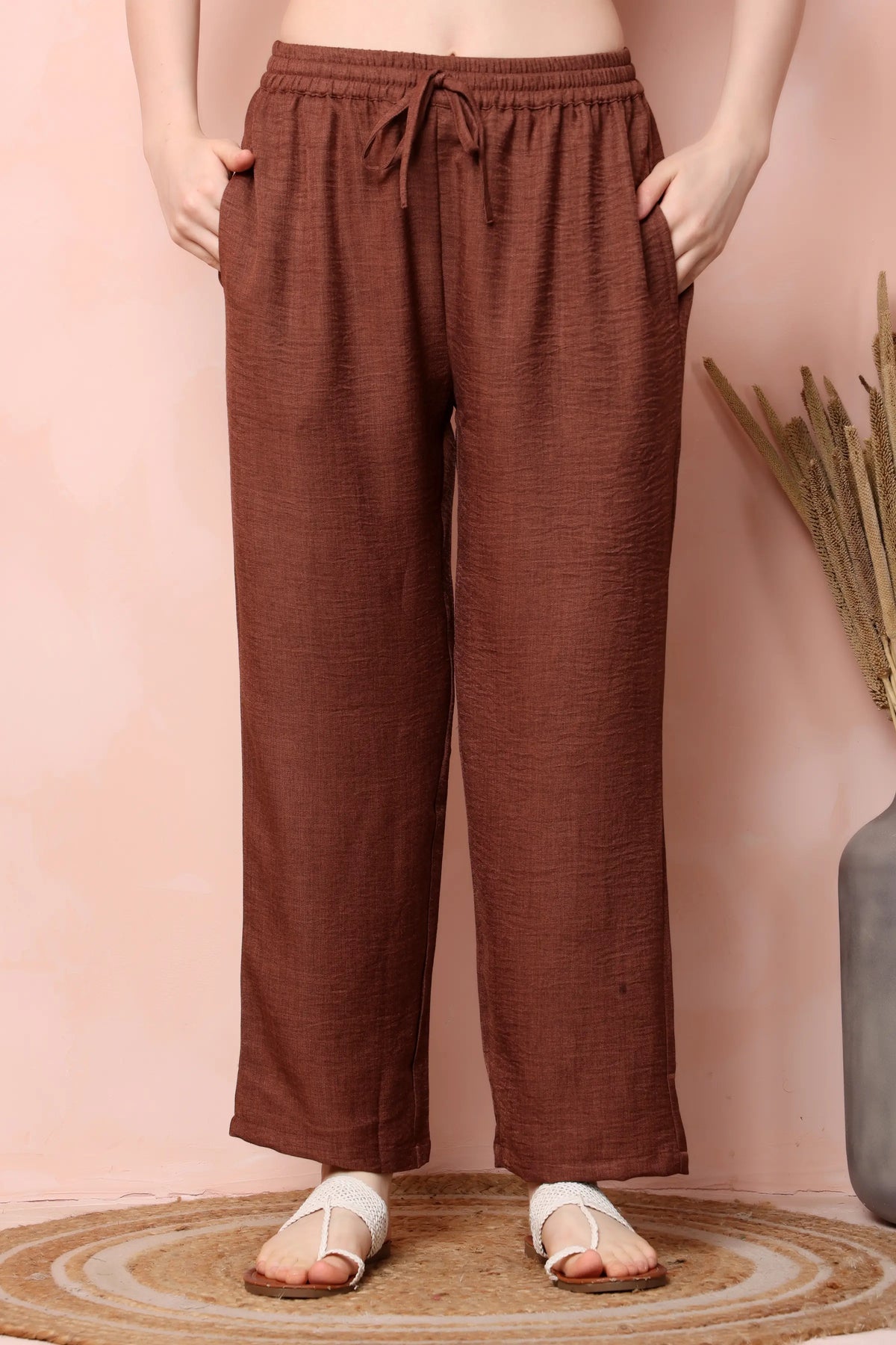 RABRIC rust brown twill co-ord trousers showing the elasticated waistband, drawstring and wide-leg cut.