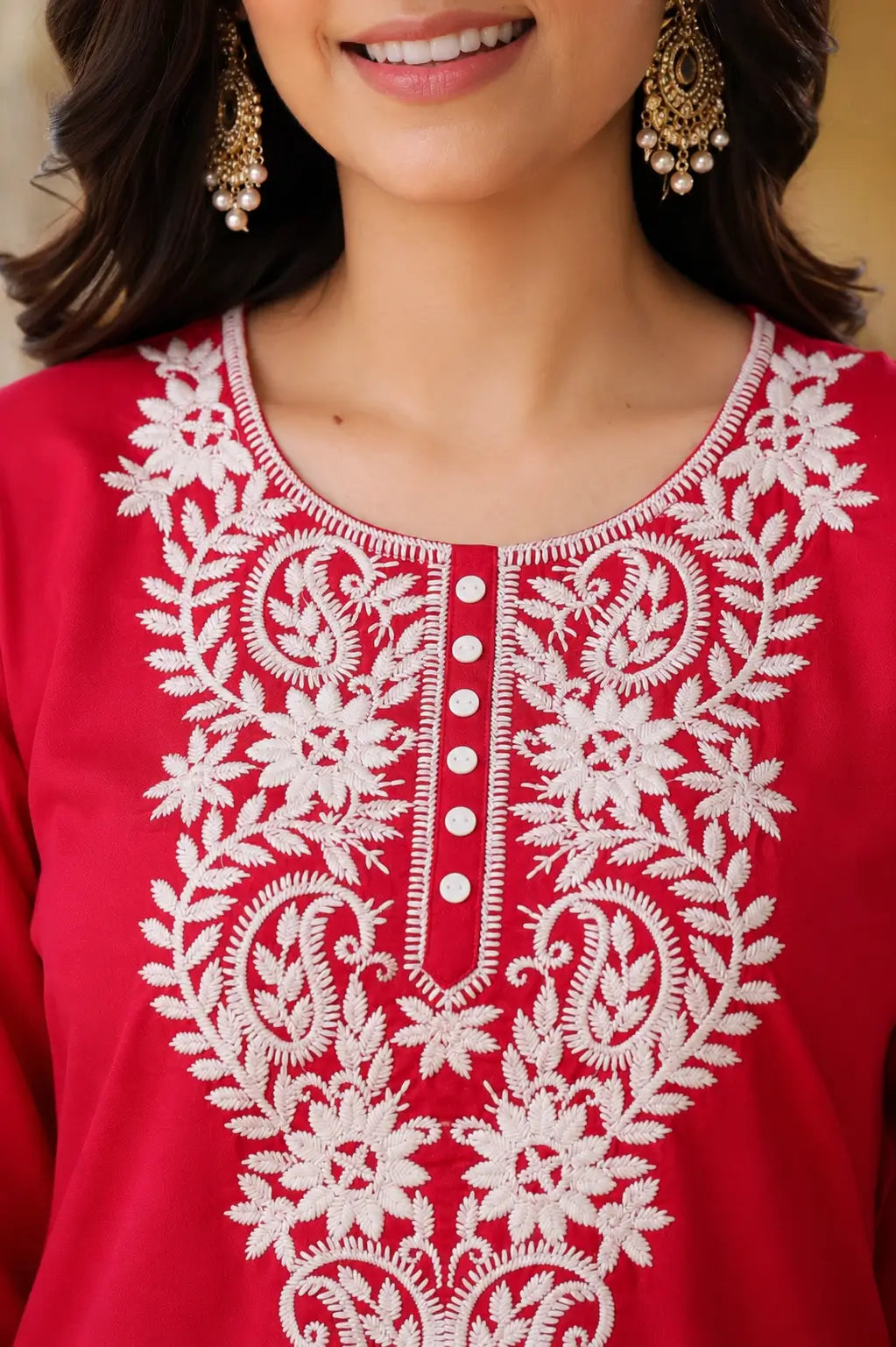 Close-up neck design of red cotton embroidered kurti for women with detailed white thread floral embroidery
