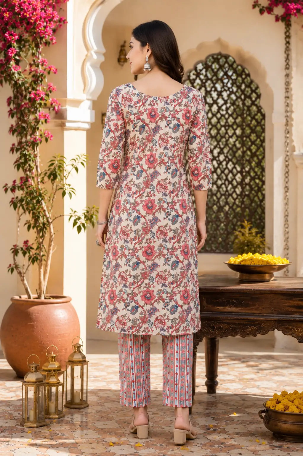 Back side view of Rabric off white floral cotton kurta pant set for women with matching printed pants