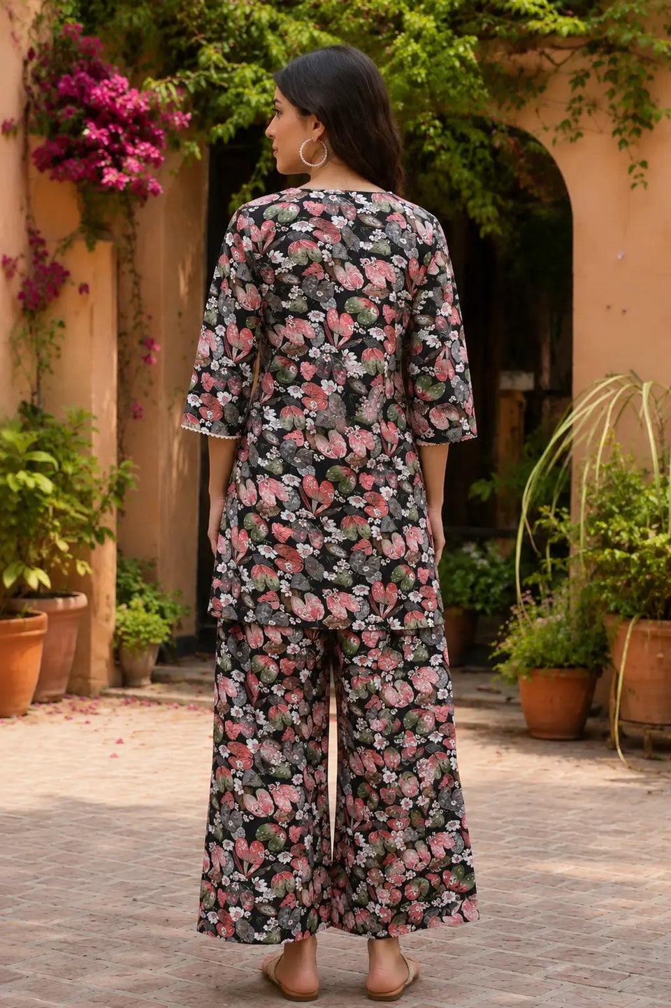 Back view of Rabric black cotton floral print co-ord set with short 3/4 sleeve kurta and matching palazzo pants
