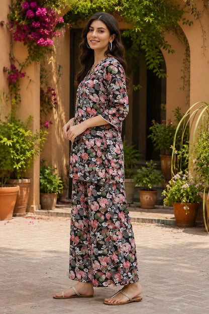 Side view of Rabric black cotton floral print co-ord set for women with short kurta and relaxed wide leg pants