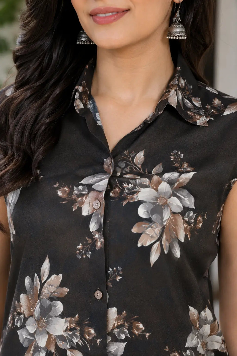 Close-up of black floral sleeveless co-ord set with collared neck