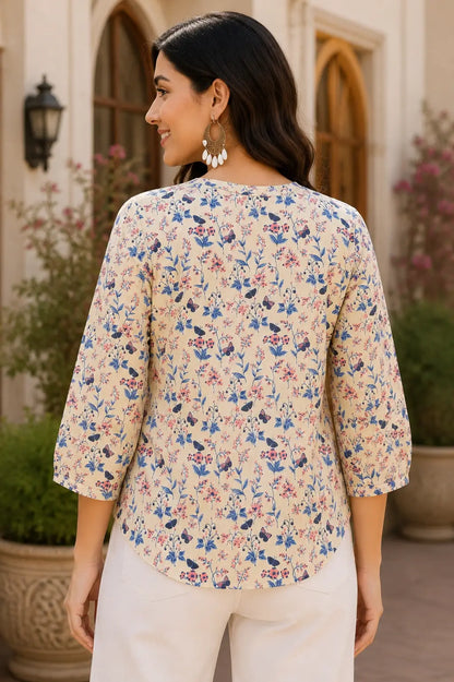 Back view of cream floral cotton short top for women with relaxed fit and 3/4 sleeves by Rabric