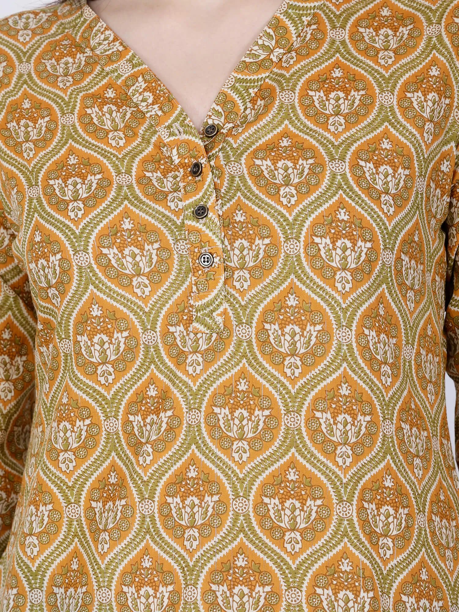 Close-up of ethnic floral print on mustard cotton kurti