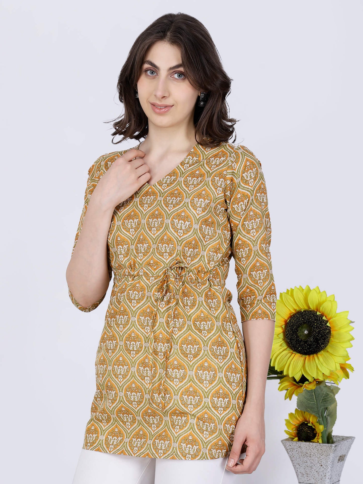 Mustard Yellow Short Kurti Styled with White Pants by Rabric