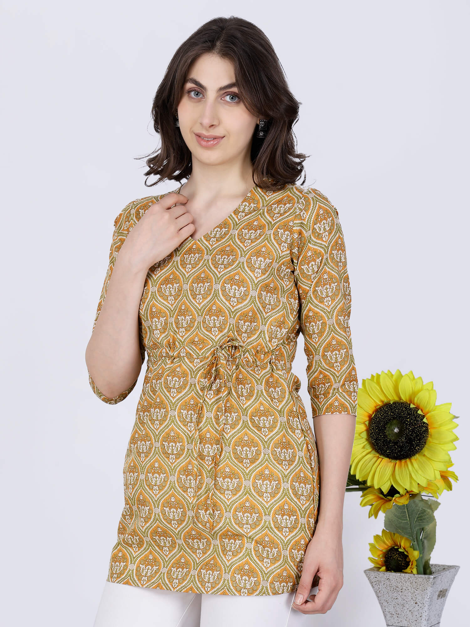 Mustard Yellow Short Kurti Styled with White Pants by Rabric