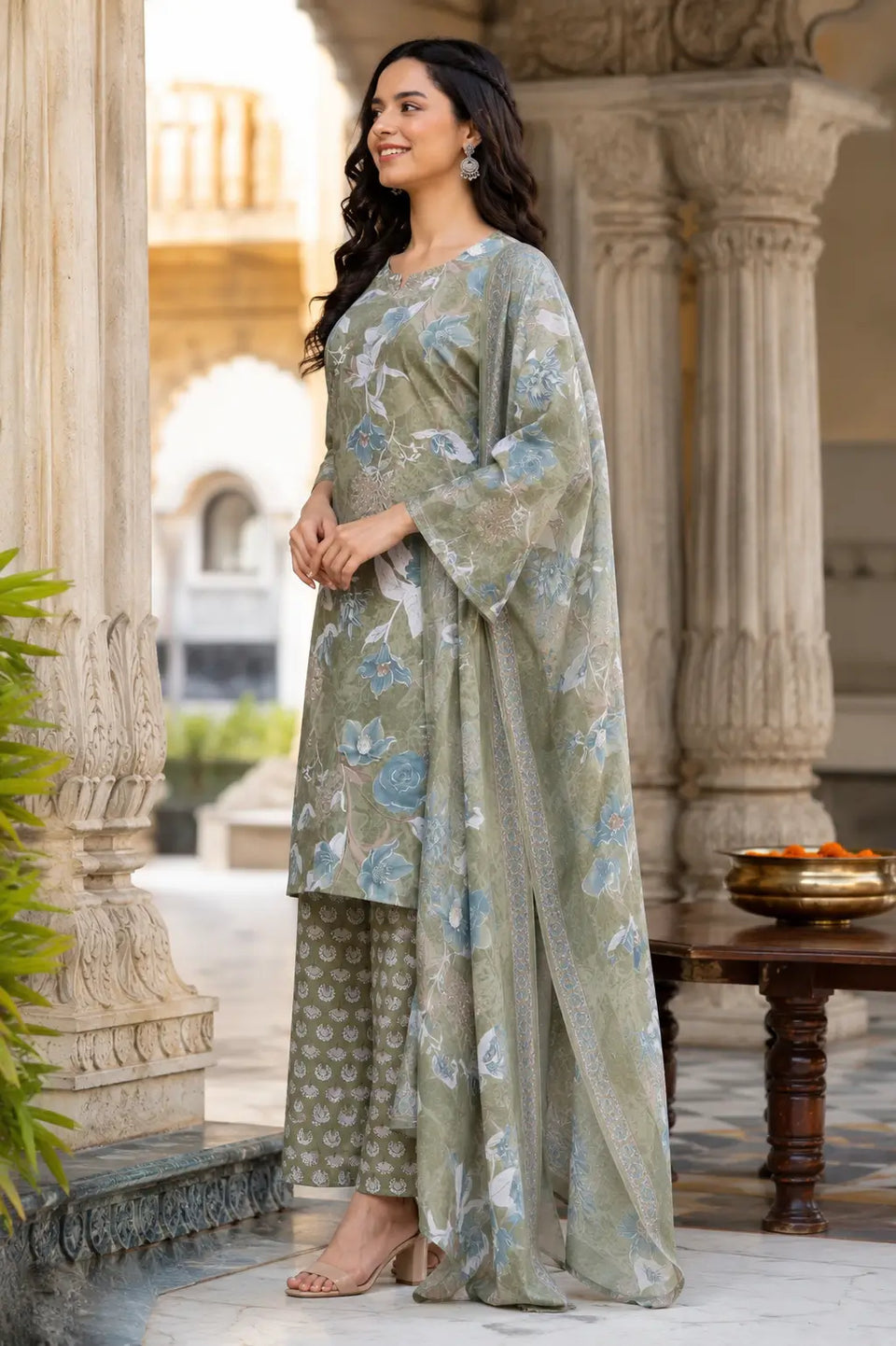 Side angle view of olive green cambric cotton floral kurta pant set with dupatta by Rabric for ethnic women wear
