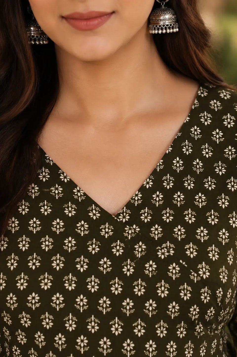 Close up of Rabric olive green Cotton floral printed short top showing V neck design for stylish daily wear women’s fashion.