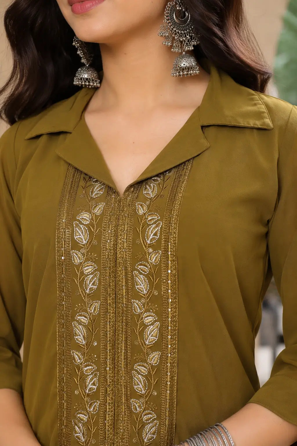 Closeup neck embroidery design on olive green satin kurta set for women with detailed ethnic thread work by Rabric