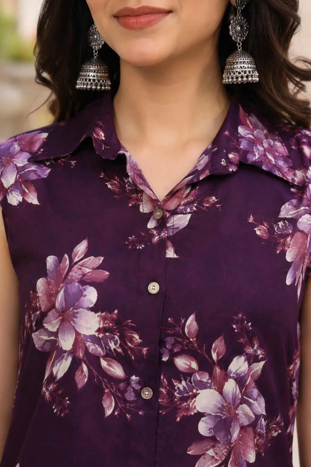 Close-up of purple floral sleeveless co-ord set with collared neck