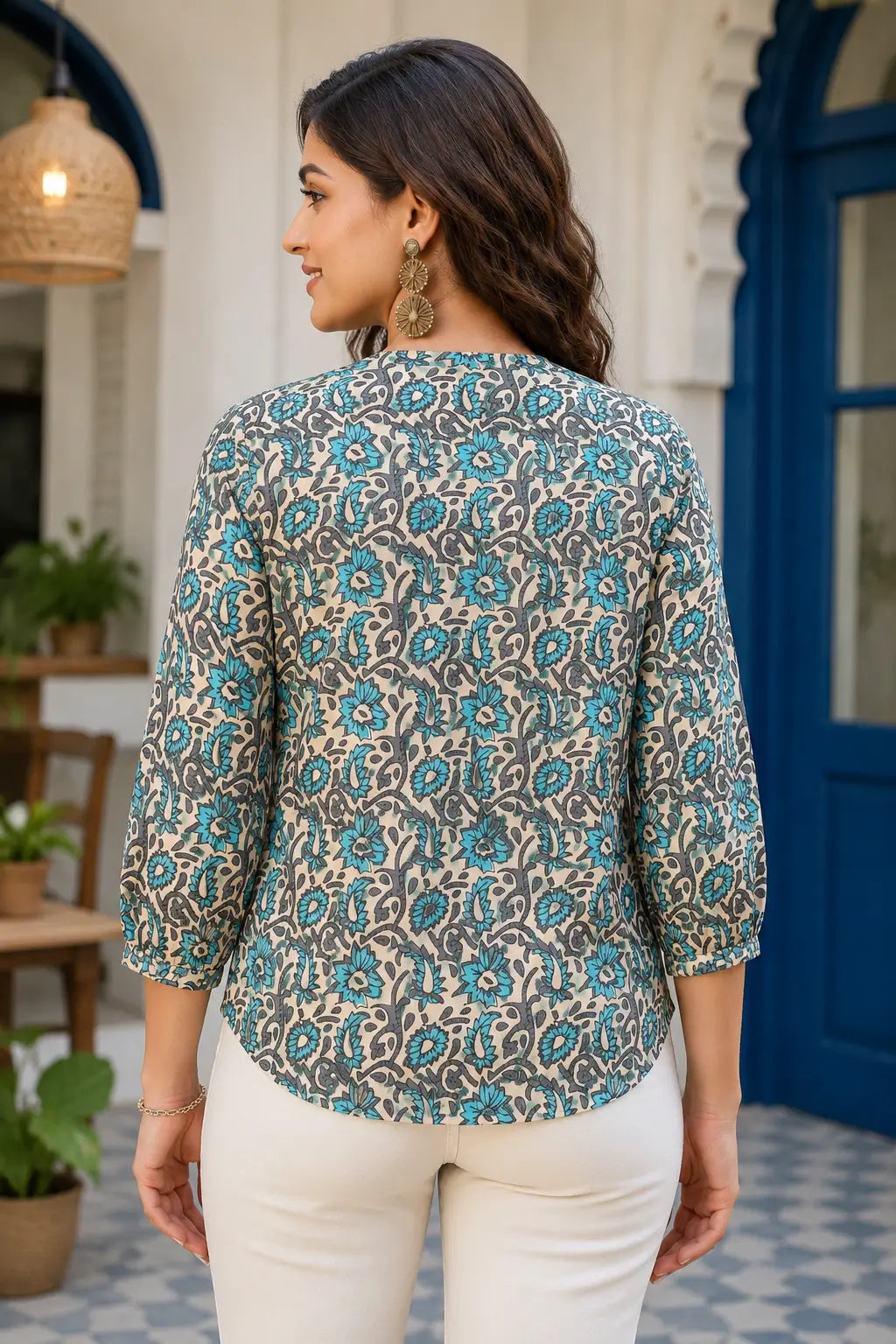 Back view of Rabric beige and turquoise blue floral cotton short top for women with 3/4 sleeves and relaxed shirt style fit