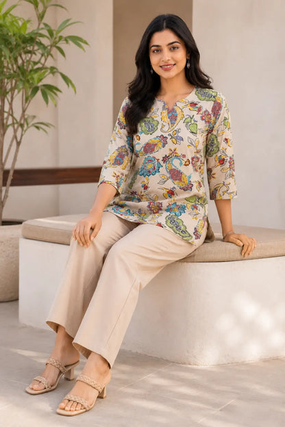 Rabric beige Cotton Flex floral paisley short top for women in casual sitting pose with 3/4 sleeves