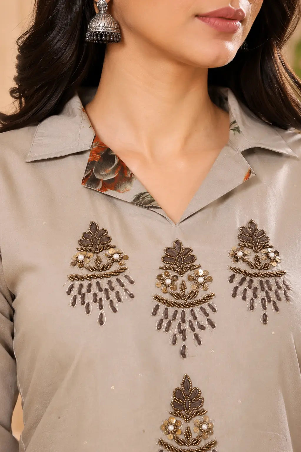 Closeup embroidered neck design of Rabric beige cotton kurta set for women