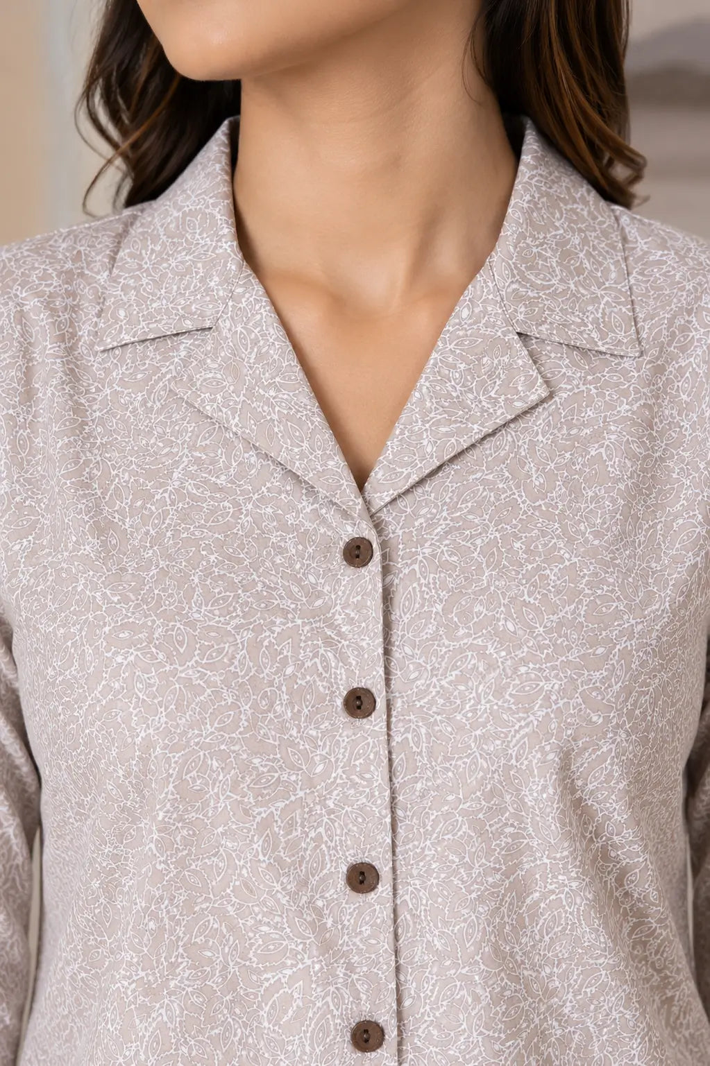 Closeup neck design of Rabric beige glace cotton women night suit featuring collar neck and button-down shirt styling
