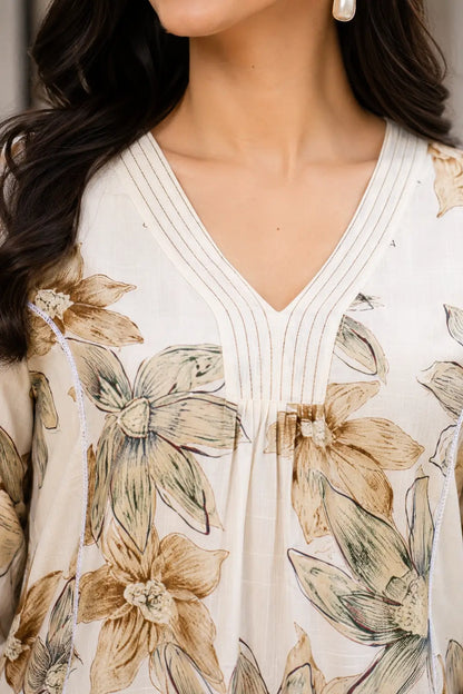 Close-up neckline detail of Rabric beige Vertican Silk floral printed women co-ord set with stylish V-neck stitching design.