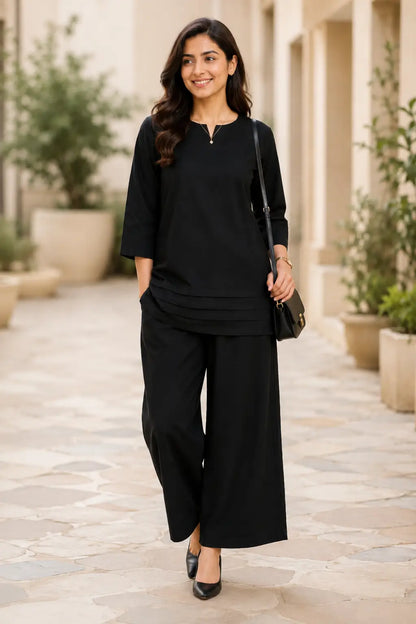 Rabric black cotton co-ord set front view for women with solid plain design, notch neck top, 3/4 sleeves and wide-leg palazzo pants