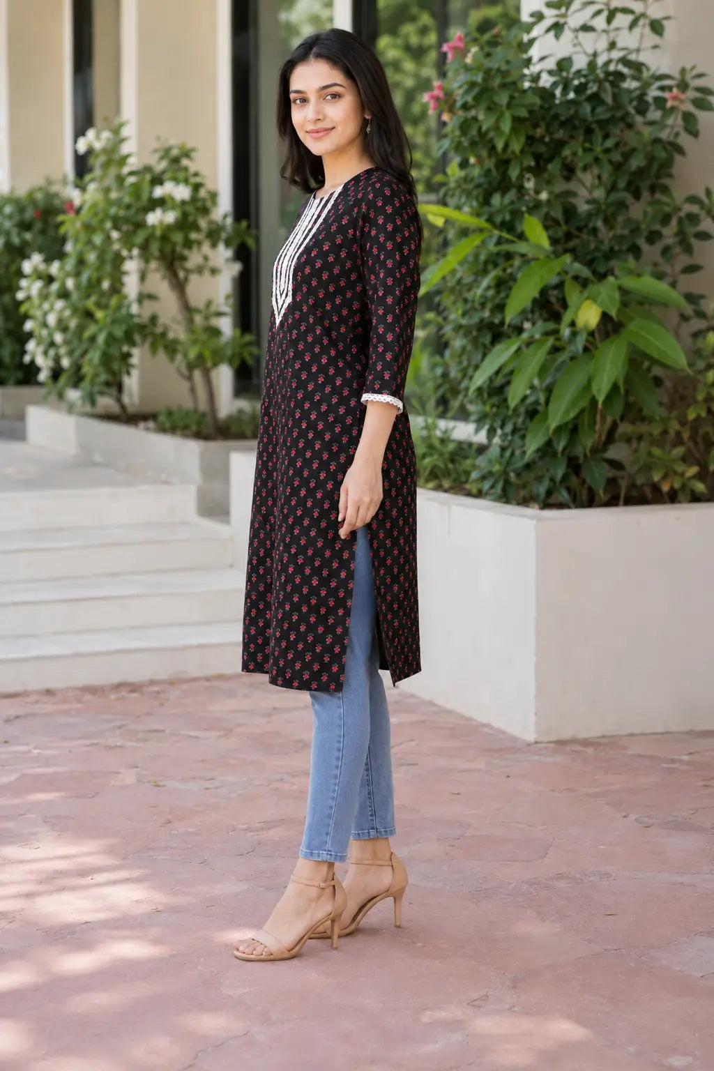 Rabric black cotton floral printed kurti for women with embroidered V-neck design, straight fit and side slit – side view
