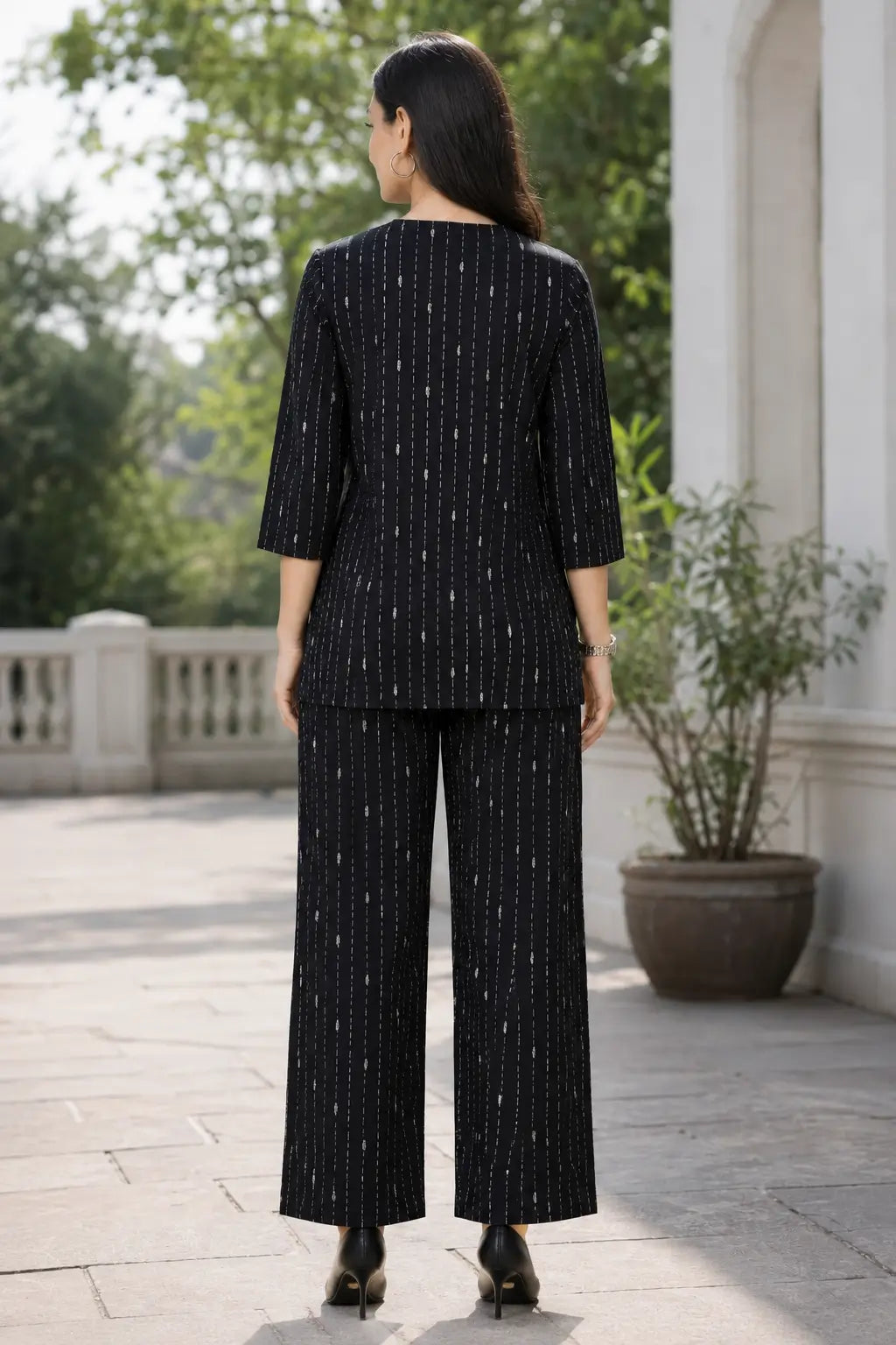 Back view of Rabric black cotton short co-ord set for women with white vertical dashed stripe print and wide pajama pants